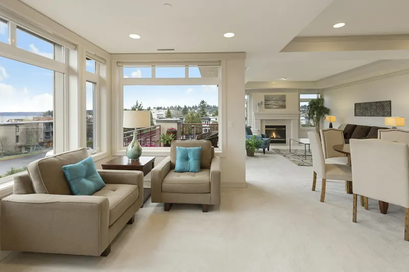 A sunlit lounge with sofas and large windows at the Renovara campus